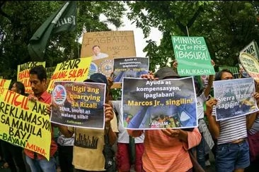 Flood survivors, fisherfolk, and environmental groups march to the Department of Environment and Natural Resources headquarters in Quezon City on September 11, 2024, to demand the cancellation of mining and quarrying permits in Rizal province. Maria Tan, ABS-CBN News