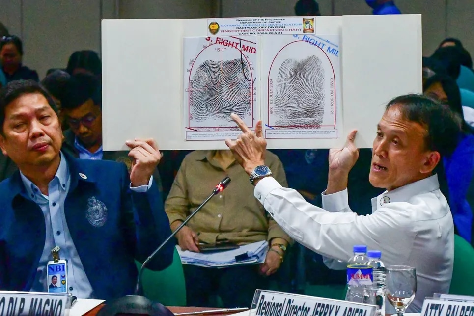 National Bureau of Investigation Dactyloscopy Division chief Dr. Alfredo Kahanding shows the matching fingerprints of suspended Bamban, Tarlac mayor Alice Guo and Guo Hua Ping and differing from another person named Alice Guo during the Senate Hearing on illegal POGOs in Pasay City on July 10, 2024. Mark Demayo, ABS-CBN News