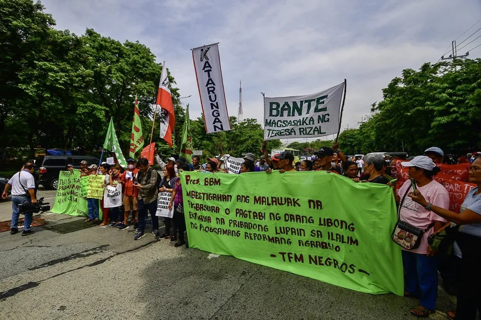 Peasant groups from various provinces picket outside the Department of Agrarian Reform in Quezon City on the 36th anniversary of the Agrarian Reform Program on June 10, 2024, calling on the agency to address critical issues affecting land distribution and ownership.