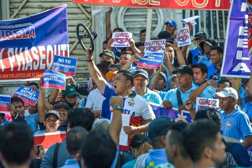 Transport group Manibela, led by its Chairman Mar Valbuena, hold a protest outside the Office of the Ombudsman on February 7, 2024, as they file a criminal case against various transport officials due to their alleged involvement in corruption in the Public Utility Vehicle Modernization Program (PUVMP) of the government. 