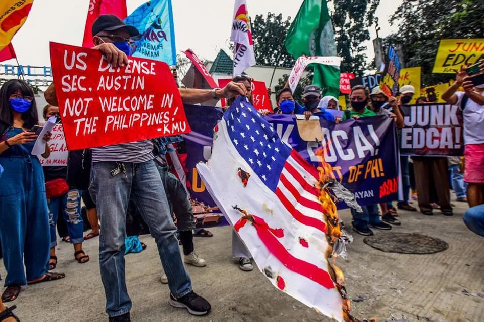 Protesters burn US flag during US defense chief Austin's visit