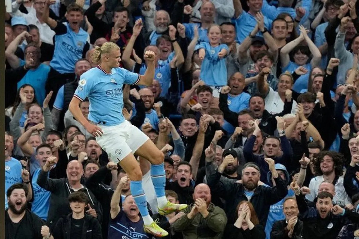 Football: Record-breaking Haaland hits City treble, Arsenal stay ...