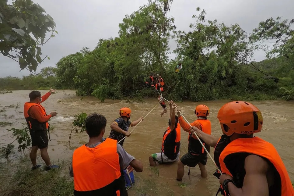 Residents evacuate home amid massive flooding in parts of Northern Luzon
