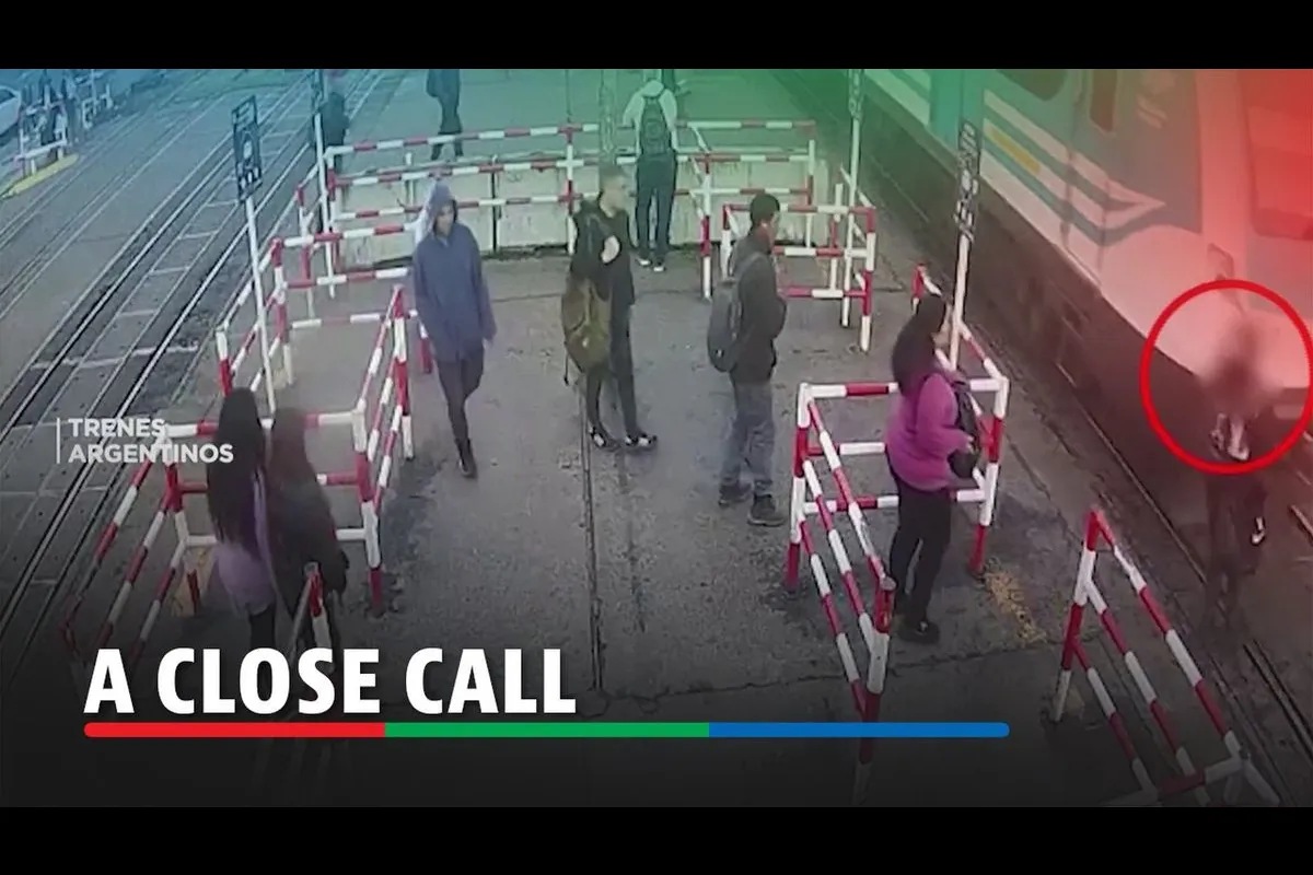 Commuter narrowly avoids train collision while looking at phone ABS