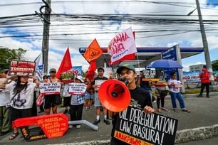 Progressive groups hold a protest on the second day of a transport strike at a gasoline station in Philcoa, Quezon City, calling for government action on rising fuel prices and policies affecting drivers. Maria Tan, ABS-CBN News