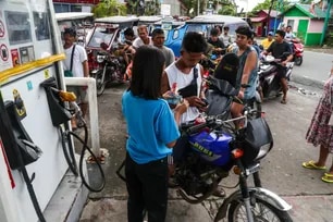 Residents line up for fuel at one of the few open gas stations in the town of Mauban, Quezon, on Monday, a day after tropical storm Aghon made landfall on May 26, 2024. Jonathan Celloa, ABS-CBN News