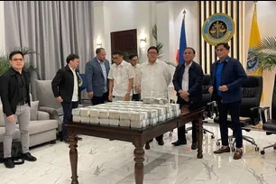 Former Department of Public Works and Highways (DPWH) engineer Henry Alcantara turns over P71 million to the Department of Justice in December 2025  as part of the restitution process in the anomalous flood control probe. ABS-CBN News, file