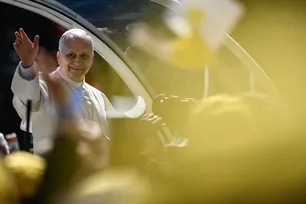 Pope Leo XIV waves from his Papamobile after meeting greets youth and catechumens at the Church of Sainte-Devote in Monte Carlo, Monaco, on March 28, 2026. Frederic Dides, AFP