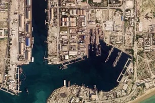 This handout satellite image taken by 2026 Planet Labs PBC shows damage at the military harbor in Iran's southern port of Bandar Abbas along the Strait of Hormuz on March 4, 2026. 2026 Planet Labs PBC via AFP