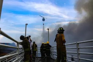 Firefighters battle a blaze that engulfs Building 9 in Barangay 105, Aroma, Tondo, Manila, on August 6, 2025.