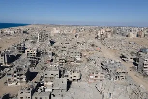 An aerial view shows the Al-Maqussi Towers district, heavily damaged by massive Israeli bombardment over the past two years, in northwestern Gaza City on October 15, 2025, during a US-brokered ceasefire between Israel and Palestinian factions. AFP/File