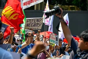 Members of Bagong Alyansang Makabayan hold a protest at the Camp Aguinaldo EDSA Gate along Boni Serrano in Quezon City on Friday, April 24, 2026, to condemn the alleged Toboso massacre in Negros Occidental. Maria Tan , ABS-CBN News