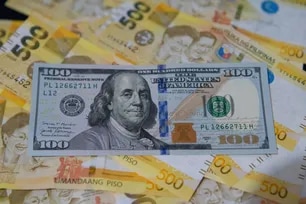 Photo illustration of US dollar to PH peso exchange in this photo taken on September 30, 2022. Gigie Cruz, ABS-CBN News