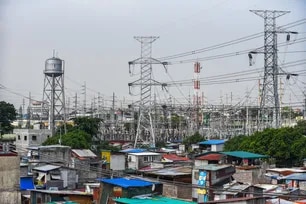 High voltage towers that support transmission lines for electrical power distribution in the Luzon grid is seen from a residential area in Baesa, Quezon City on Tuesday, May 9 2023. The National Grid Corporation declared a red alert status on the Luzon grid on Monday, raising the possibility of power shortage or brownouts in some provinces. The NGCP also said that three power plants are “running on derated capacities” and other five are “on forced outage”. Maria Tan, ABS-CBN News