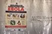 A poster displaying Ebola emergency contact numbers is pinned to a tent at the Busunga border crossing between Uganda and the Democratic Republic of Congo in Bundibugyo, on May 18, 2026. Badru Katumba, AFP