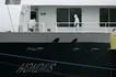 A person wearing a protective suit walks aboard the Dutch Hantavirus-hit cruise ship MV Hondius after arriving at the port of Rotterdam on May 18, 2026. Nicolas Tucat, AFP