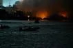 Members of the Philippine Coast Guard continue to monitor the ongoing fire in Brgy. Parola as firefighting operations remain underway, May 23, 2026. Maria Tan, ABS-CBN News