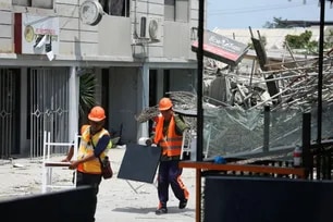 Government rescuers and local officials check on residents and businesses affected by the building collapse in Barangay Balibago, Angeles, Pampanga on May 25, 2026. Crews are currently working to restore internet and utility lines, though surrounding residential homes remain without electricity due to downed power lines.  Jonathan Callona, ABS-CBN News