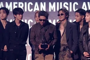 BTS accepts Artist of the Year at the 2026 American Music Awards, May 26, 2026. Screenshot from the X account of the American Music Awards