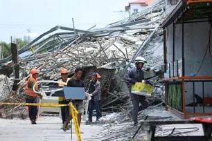 Government rescuers and local officials check on residents and businesses affected by the building collapse in Barangay Balibago, Angeles, Pampanga on May 25, 2026. Jonathan Callona, ABS-CBN News