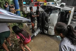 People try to walk among vehicle debris at the site of a 9-vehicle automobile accident along Sumulong Highway in Antipolo, Wednesday. August 22, 2018. Jonathan Cellona, ABS-CBN News/File