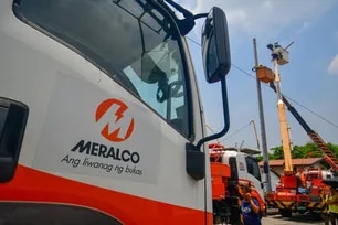 Workers clear out debris and replace electric lines and posts knocked down by a ten-wheeler truck through a domino effect in Brgy. Lambakin, Marilao, Bulacan on August 20, 2024. The Manila Electric Company (MERALCO) aims to restore power to around 700 homes affected by the incident within the day. Mark Demayo, ABS-CBN News