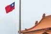 The Taiwanese flag at Democracy Boulevard is lowered at the end of the day as the Chiang Kai-shek Memorial Hall is seen in the background in Taipei on May 13, 2026. I-Hwa Cheng, AFP