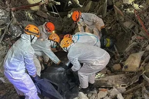 BFP-Central Luzon firefighters retrieve a body from a collapsed nine-story building under construction in Angeles City late Monday night, June 1, 2026. BFP Central Luzon/File