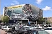 Vehicles drive past a large billboard reading "The Strait of Hormuz remains closed" as people gather in Tehran's Revolution Square after the United States and Iran agreed to a two-week ceasefire, on April 8, 2026. Atta Kenare, AFP