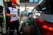 Motorists line up at a gasoline station along Philcoa in Diliman, Quezon City on Friday, March 6, in a rush to refuel ahead of the expected fuel price increase next week. Long queues of cars and motorcycles formed as drivers tried to fill up before the anticipated hike in gasoline and diesel prices.  Maria Tan, ABS-CBN News