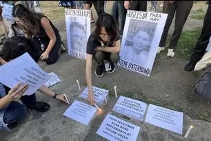 Students gather outside Ateneo de Manila University in Quezon City on June 10, 2026 to join the families of student-athletes Rene Baterbonia and Divine Adili in seeking answers and accountability following their deaths. Lyza Aquino, ABS-CBN News 