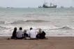 In this picture obtained from Iran's ISNA news agency on April 24, 2026, Iranians are seen at Suru Beach in Bandar Abbas along the Strait of Hormuz. Razieh Poudat, ISNA via AFP