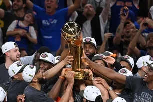 The New York Knicks celebrate with the Larry O'Brien Championship Trophy after winning the 2026 NBA Finals against the San Antonio Spurs on June 13, 2026 at Frost Bank Center in San Antonio, Texas. Juan Ocampo, NBAE via Getty Images/AFP
