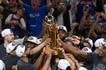The New York Knicks celebrate with the Larry O'Brien Championship Trophy after winning the 2026 NBA Finals against the San Antonio Spurs on June 13, 2026 at Frost Bank Center in San Antonio, Texas. Juan Ocampo, NBAE via Getty Images/AFP