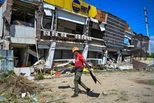 A responder prepares to take part in search and rescue operations outside a collapsed building after a 7.8 magnitude earthquake in General Santos City on June 9, 2026. Jam Sta. Rosa, AFP