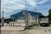 Police investigators walk in front of the school entrance after a shooting incident at a high school compound in Tacloban City, Leyte province on June 22, 2026. At least three teenaged students were killed in the shooting. Noel  Sianosa, AFP
