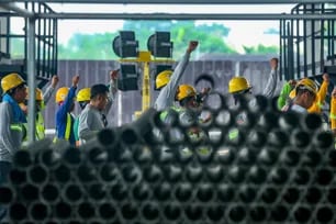 Workers are seen at the Precast Concrete Yard in Santa Rosa, Laguna on June 13, 2024. The factory is in full swing as they produce concrete parts which will then be assembled to finish the South Commuter Railways Jonathan Cellona, ABS-CBN News