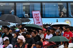 Members of the religious group Iglesia ni Cristo (INC) stage a demonstration along Epifanio de los Santos Avenue in Quezon City, Metro Manila on June 30, 2026.