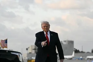 US President Donald Trump gives a thumbs up upon arrival at Miami International Airport in Miami, on April 11, 2026.