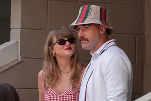 US singer-songwriter Taylor Swift (L) and US NFL football player Travis Kelce (R) attend the men's final match between Italy's Jannik Sinner and USA's Taylor Fritz on day fourteen of the US Open tennis tournament at the USTA Billie Jean King National Tennis Center in New York City, on September 8, 2024. Timothy A. Clary, AFP/File