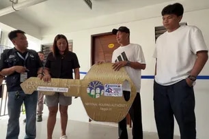 The Baterbonia family receives keys to a new condo unit in Davao City, July 4, 2026. Hernel Tocmo, ABS-CBN News