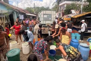 Residents line up to fill buckets and drums from a water tanker amid a water crisis in Real, Quezon, July 5, 2026. Dennis Datu, ABS-CBN News