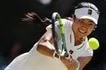Philippines' Alexandra Eala returns to Italy's Jasmine Paolini during their women's singles round of 16 tennis match on the eighth day of the 2026 Wimbledon Championships at The All England Lawn Tennis and Croquet Club in Wimbledon, southwest London, on July 6, 2026. Adrian Dennis, AFP