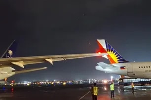 Parked PAL plane's tail fin damaged by Saudia jet at NAIA