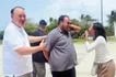 Philippine Air Force Airman 2nd Class Clyde Kent Enriquez and public school teacher Lucky Gaea Marie Bolante, together with Defense Secretary Gilberto Teodoro Jr. in Pag-asa Island, July 12, 2026. Bianca Dava, ABS-CBN News