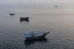 This aerial photograph shows boats anchored off Oman’s northern Musandam Peninsula near the Strait of Hormuz on June 27, 2026. AFP