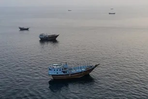 This aerial photograph shows boats anchored off Oman’s northern Musandam Peninsula near the Strait of Hormuz on June 27, 2026. AFP