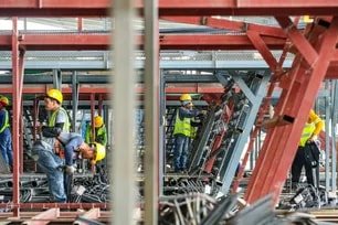 Workers are seen at the Precast Concrete Yard in Santa Rosa, Laguna on June 13, 2024. The factory is in full swing as they produce concrete parts which will then be assembled to finish the South Commuter Railways Jonathan Cellona, ABS-CBN News