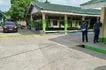 Policemen stand near the crime scene of a school compound after a shooting incident at a high school compound in Tacloban City, Leyte province on June 22, 2026.
