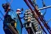 Workers inspect an electric meter installed above ground in Manila on January 11, 2024. Mark Demayo, ABS-CBN News